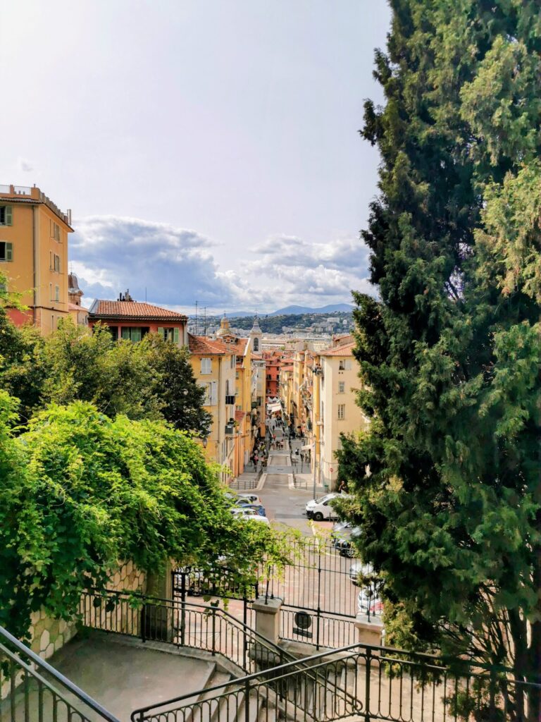 View over colourful rooftops and streets of Nice Old Town from above.