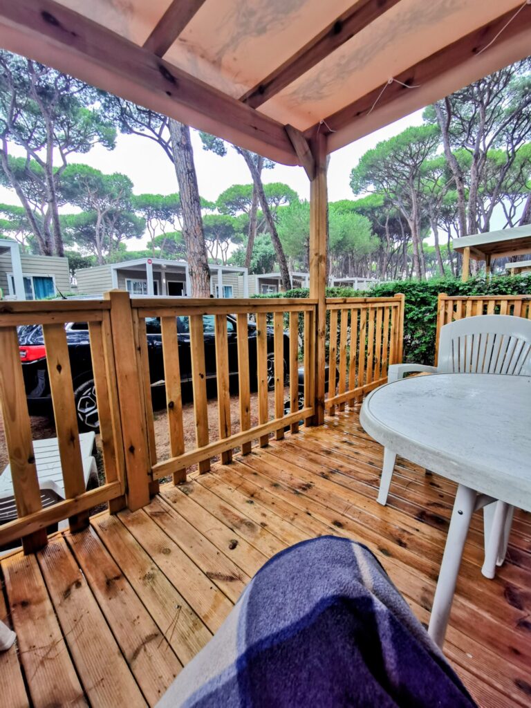 View from a Eurocamp Veranda with outdoor table, decking, and trees