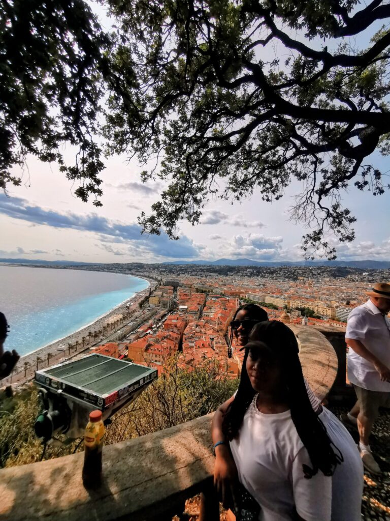 View over Nice Old Town and coastline from Castle Hill with people overlooking the city.