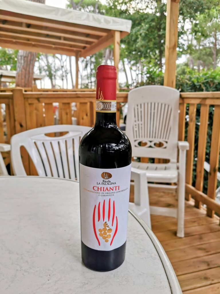 Wine and snacks outside a caravan during a summer holiday in Tuscany, 