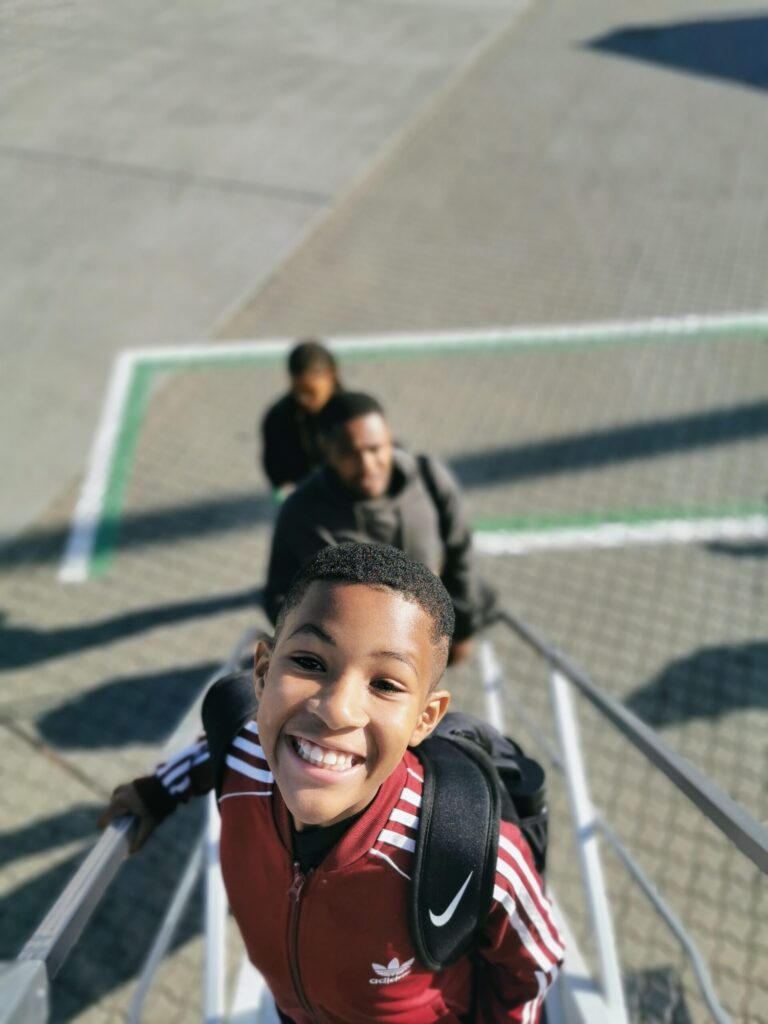Young boy boarding a flight for a family holiday to Europe. 