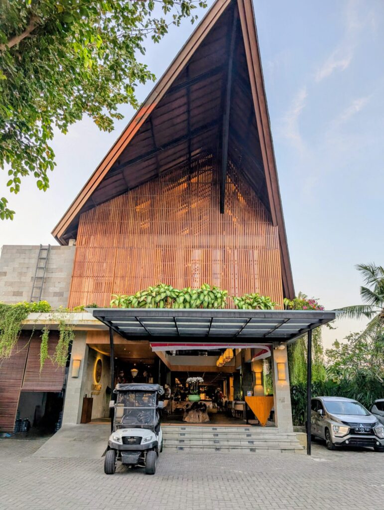 Stylish hotel entrance with neutral tones and modern design in Bali.  