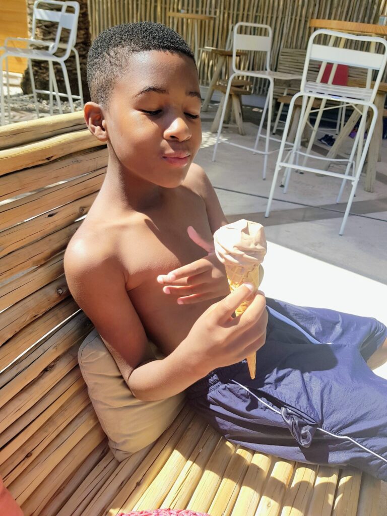 Young boy enjoying an ice cream at a Eurocamp campsite in the South of France.