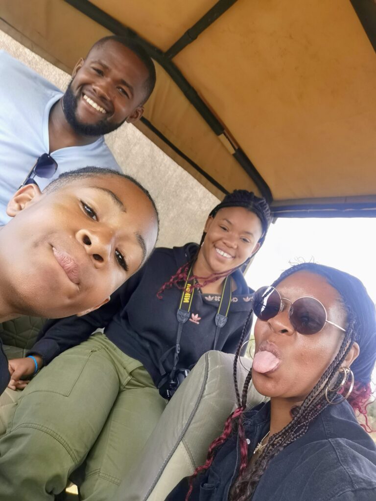 Family taking a playful selfie together whilst travelling.