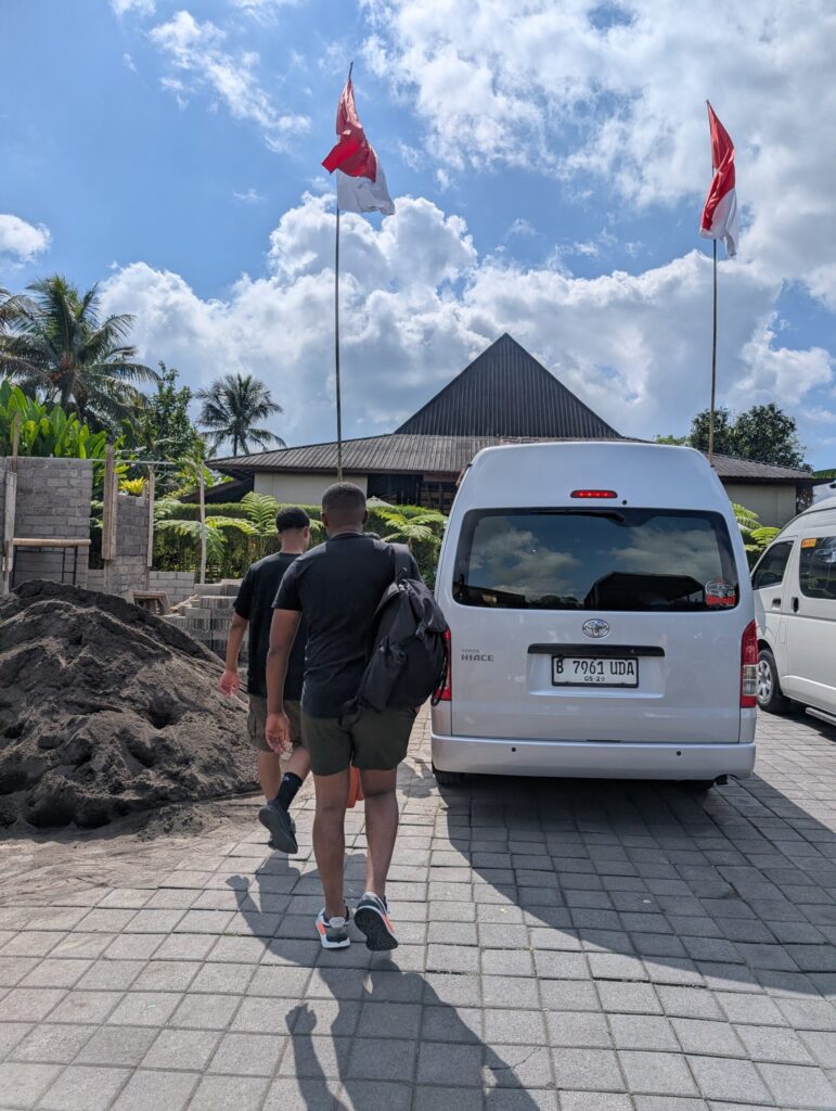 Walking back to our private driver and minivan during our Bali family holiday