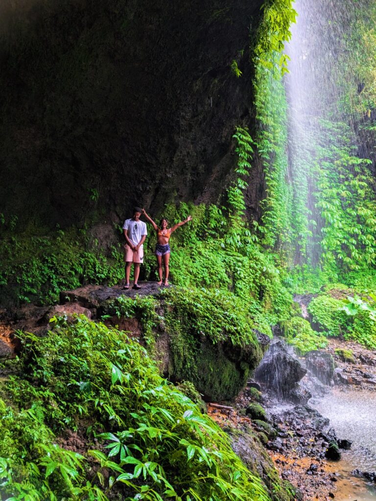 Me and my son at a waterfall in Bali during our journey from Ubud to Seminyak