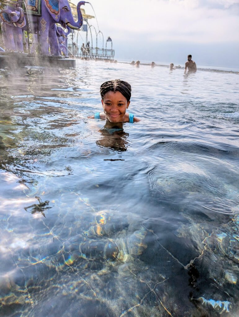 Our daughter swimming in the Batur natural hot springs in Bali